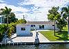 Canal to house view with shed for storing your fishing and snorkel gear. 