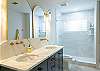 Dual vanity and large walk in shower for easy access for guests