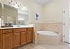 Master Bathroom with soaking tub and separate shower.