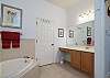 Master Bathroom includes double vanities, shower and separate soaking tub.