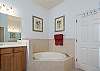 Master Bathroom includes double vanities, shower and separate soaking tub.