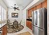 The kitchen includes stainless steel appliances.