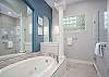 Large Master Bathroom with Glass Shower and Separate Tub.