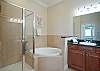 Master Bathroom features soaking tub and separate shower. 