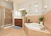Master Bathroom with Walk-in Shower and Soaking Tub.