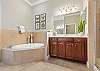 Master Bathroom features Dual vanities, soaking tub & separate shower. 