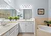 Ensuite features with double vanities, soaking tub and separate shower. 