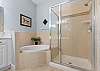 Ensuite features with double vanities, soaking tub and separate shower. 