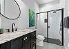 Full Bathroom on ground Level with walk-in shower and convenient access from the patio/pool area. 