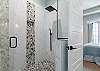 Primary Ensuite features dual vanities and large shower.