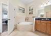 Master Ensuite with Soaking Tub and Separate Shower.