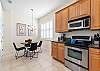 The kitchen table by the window is the ideal spot for breakfast. 