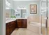 Primary King Ensuite with soaking tub and separate shower.