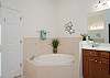 Master Bathroom showcases a soaking tub, separate shower and double vanities. 