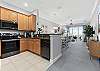 Open-Concept Kitchen with black stainless appliances. 