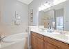Primary Bathroom features Soaking Tub, Separate Shower and Dual Vanities.