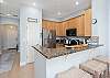 Additional Seating at the kitchen counter is ideal for a snack before hitting the pool and the beach. 