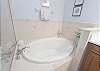 Primary Bathroom features Soaking Tub, Separate Shower and Dual Vanities.
