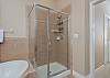 Master Bathroom with double vanity, soaking tub and separate shower. 