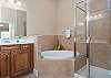 Master Bathroom with double vanity, soaking tub and separate shower. 