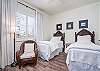 3rd bedroom features 2 plush Twin beds with a bathroom across the hall. 