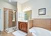 Master Bathroom features double vanities, shower and separate soaking tub. 
