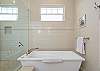 Relax in the beautiful master bathroom tub on the top floor. 