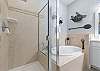 King Primary Ensuite with dual vanity, soaking tub and separate shower. 