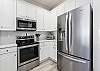Bright Kitchen with Stainless Steel  Appliances