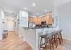 Seating at the Kitchen counter is the idea spot to grab a snack before heading to the pool.