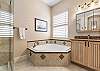 Master Ensuite with Soaking Tub and Separate Shower.