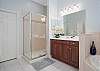 Master Bathroom features shower and separate soaking tub.