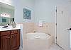 Master Bathroom features shower and separate soaking tub.