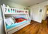 This 2nd Level Bedroom features a Twin over Full Bunk with Trundle and TV.