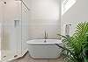 King Master Ensuite with Dual Vanities, Soaking Tub, and Separate Shower.