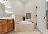 Master Ensuite with Dual Vanities, Soaking Tub and Separate Shower.
