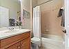 Queen Ensuite Bathroom with Shower/Tub combo.