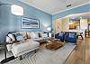 The living room brings the beautiful ocean blues in while you are not at the beach.