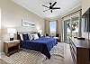King Master Suite with ocean views and access to the balcony.