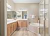 King Master Ensuite with soaking tub, separate shower and double vanity.