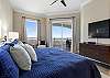 King Master Suite with ocean views and access to the balcony.