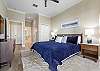 King Master Suite with ocean views and access to the balcony.