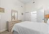 Queen guest bedroom features a calming ocean touches. 