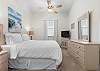 Queen guest bedroom features a calming ocean touches. 