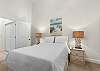 Queen guest bedroom features a calming ocean touches. 