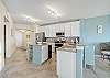 Kitchen has island great from prep and additional seating. 