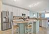 Open and Bright Kitchen with Stainless Steel Appliances.