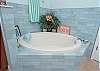 Master Ensuite features soaking tub and separate shower and dual vanities. 