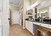 Primary Ensuite with Soaking Tub, Separate Shower, and Double Vanities.