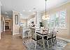 Take a seat at the dining table or the kitchen counter. 